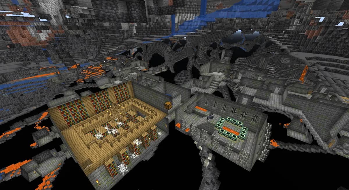A stronghold with its library and end portal room, seen from above through the stone in spectator mode